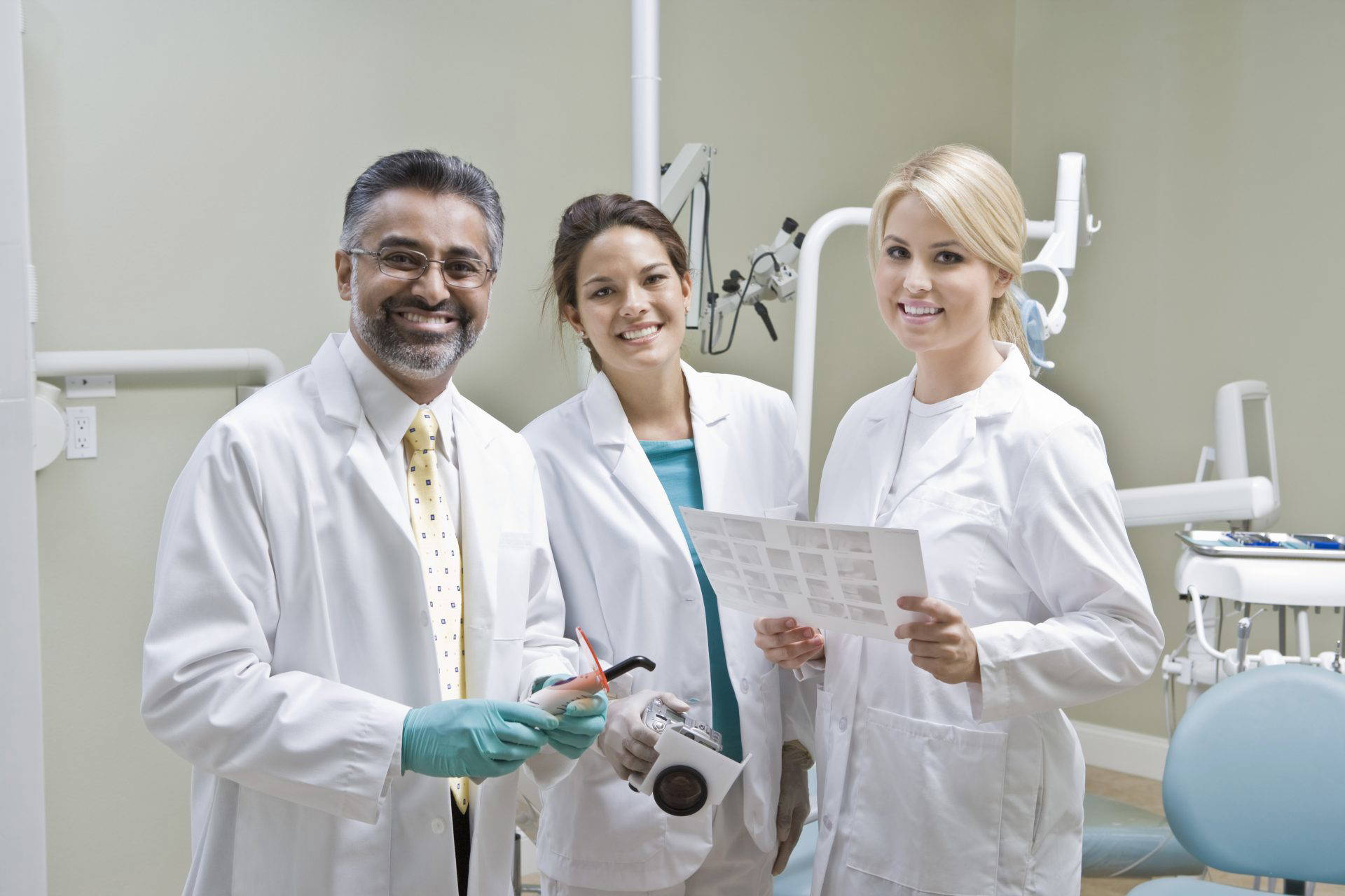 Dental team in consultation, reviewing a patient case together
