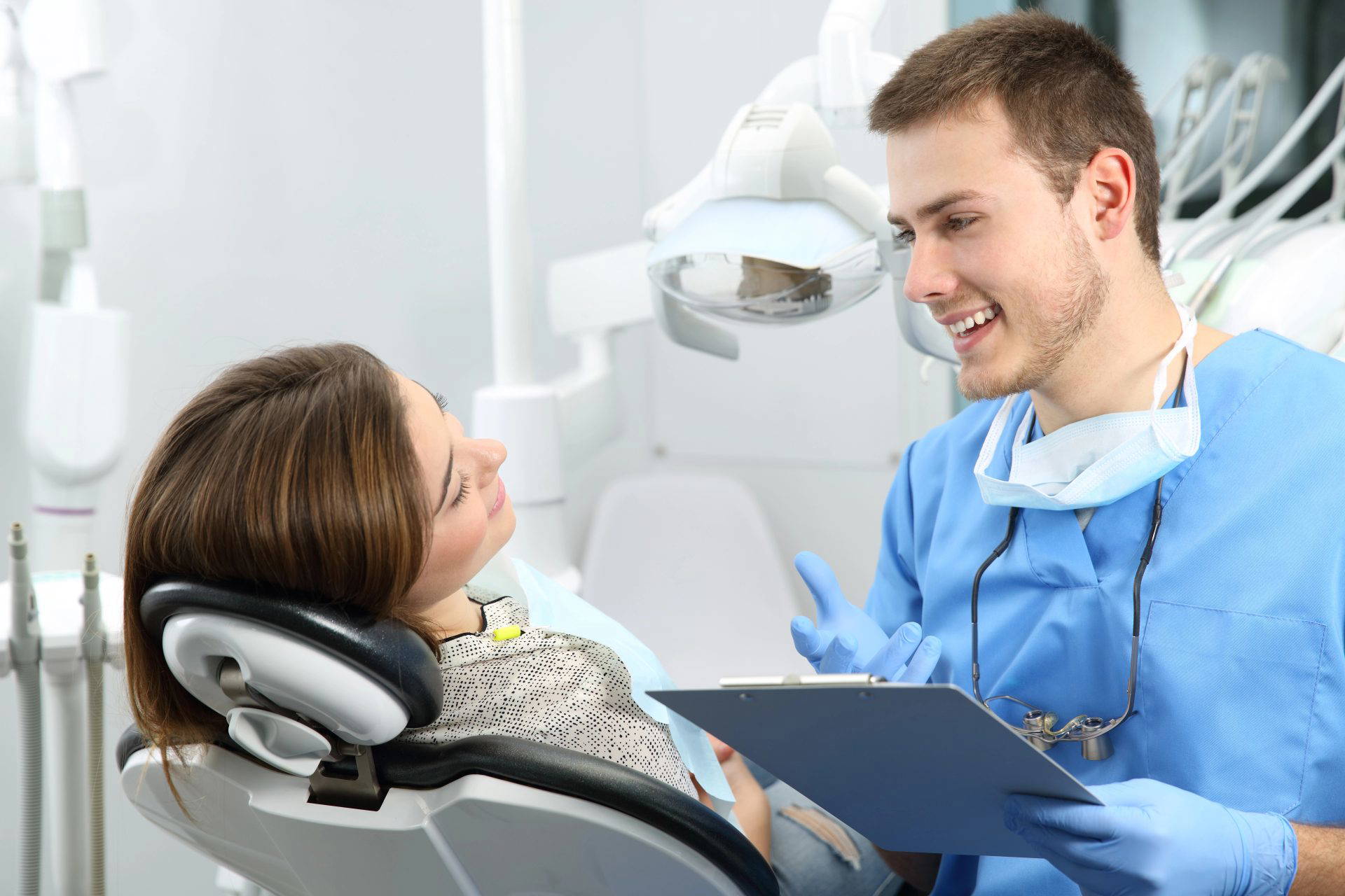 Dentist using a mirror and probe during a dental check-up