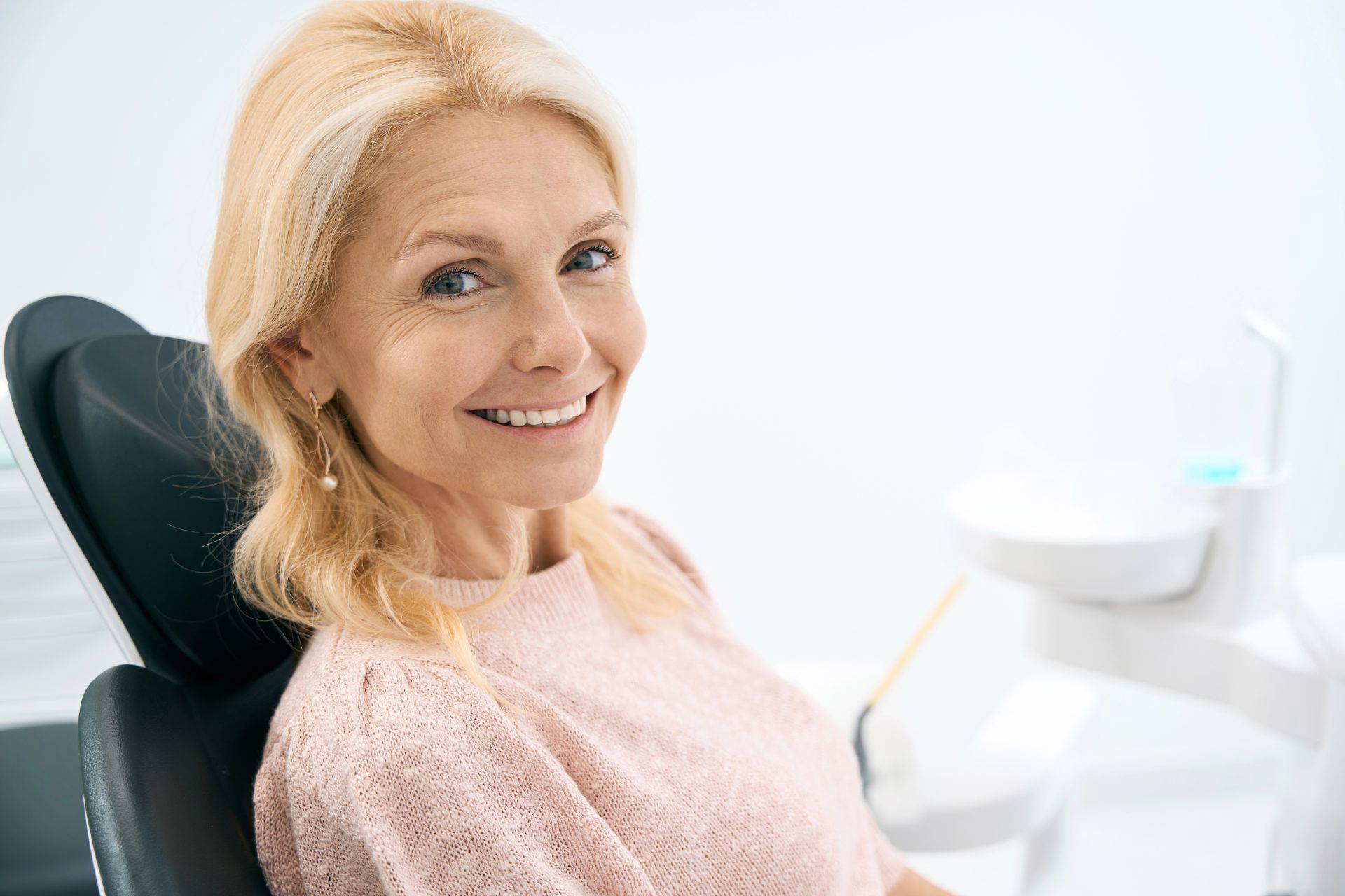 Older woman smiling confidently with bright white teeth